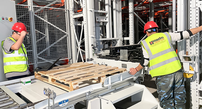 HUAYIDE engineers debugging conveyor system for 4 way shuttle warehouse project in Vietnam