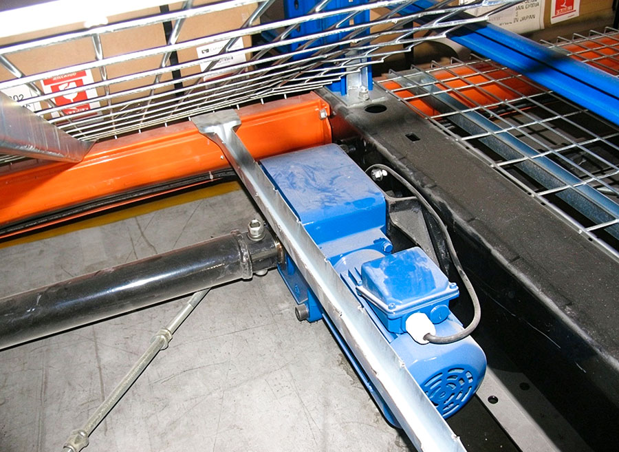 HUADE drive motor mounted on the side of a mobile pallet racking system base