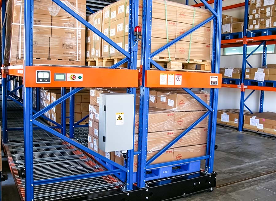HUADE intelligent control panel installed on a mobile pallet racking system with warning light and electrical control box