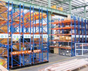 Mobile pallet racking system with movable rack bases for warehouse storage