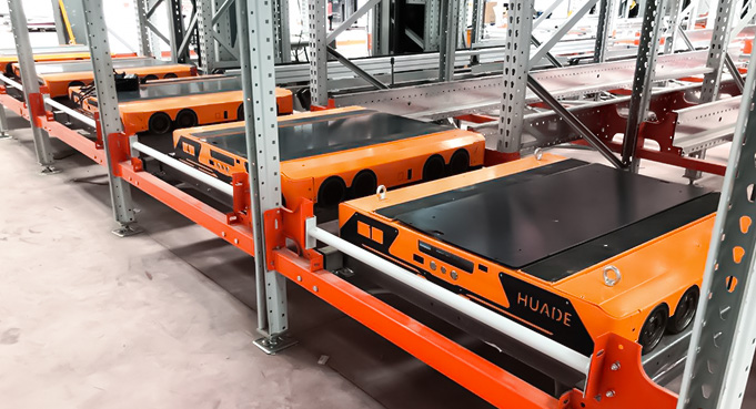 Four Way Pallet Shuttle Operating in Storage Aisle